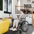 Who assists ndis participants to develop their ndis plan?